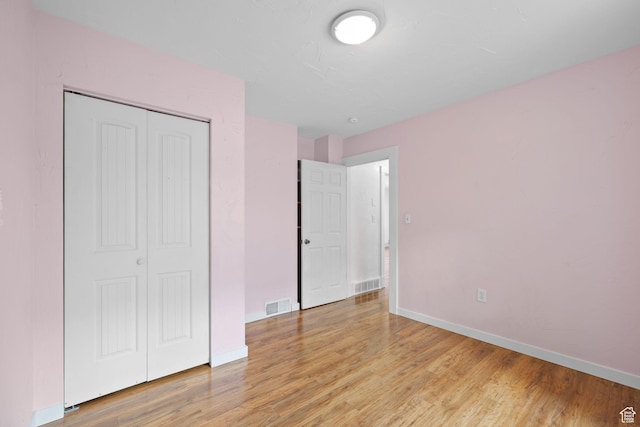 234 W 500 S, Provo, UT 84601 - unfurnished bedroom with light wood finished floors, a closet, and baseboards