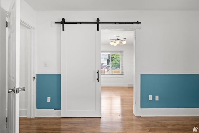 234 W 500 S, Provo, UT 84601 - hall with a barn door, wood finished floors, and baseboards