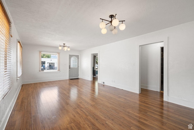 234 W 500 S, Provo, UT 84601 - unfurnished living room featuring a chandelier, wood finished floors, a textured ceiling, and baseboards