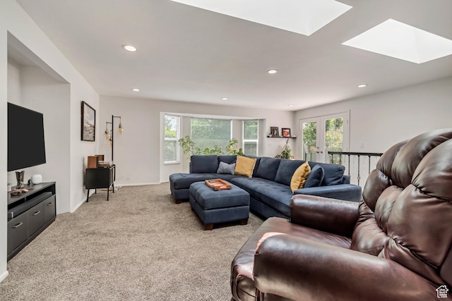 10453 S 2775th St W, South Jordan, UT 84095 - living area with a skylight, light colored carpet, healthy amount of natural light, and recessed lighting