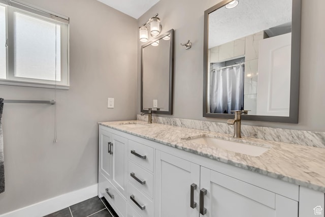 10453 S 2775th St W, South Jordan, UT 84095 - full bath featuring double vanity, baseboards, tile patterned flooring, and curtained shower