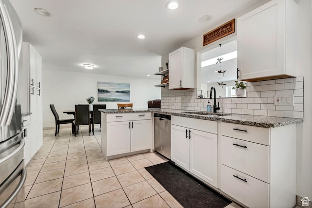 10453 S 2775th St W, South Jordan, UT 84095 - kitchen featuring a sink, stainless steel appliances, tasteful backsplash, white cabinetry, and light tile patterned floors
