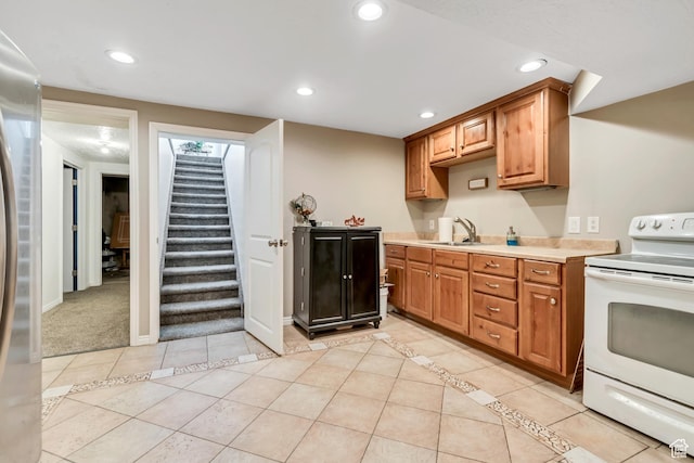 10453 S 2775th St W, South Jordan, UT 84095 - kitchen with white electric range oven, a sink, light countertops, recessed lighting, and light tile patterned floors