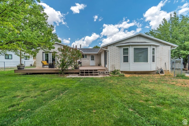 10453 S 2775th St W, South Jordan, UT 84095 - back of property featuring a deck and brick siding