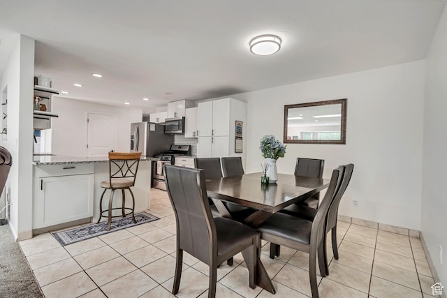10453 S 2775th St W, South Jordan, UT 84095 - dining space with light tile patterned floors, recessed lighting, and baseboards
