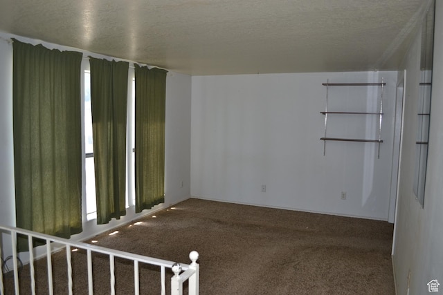 3037 S 2000 W, Syracuse, UT 84075 - empty room with carpet floors and a textured ceiling