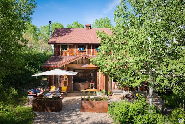 10754 Basin Canyon Rd, Park City, UT 84098 - rear view of property featuring a chimney, metal roof, and a patio