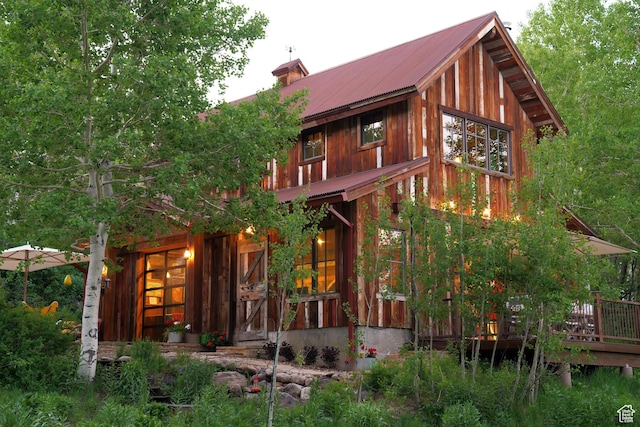 10754 Basin Canyon Rd, Park City, UT 84098 - back of house with metal roof, a chimney, and a wooden deck
