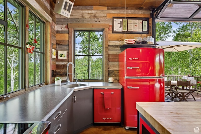 10754 Basin Canyon Rd, Park City, UT 84098 - kitchen featuring a sink, wood walls, range, and fridge