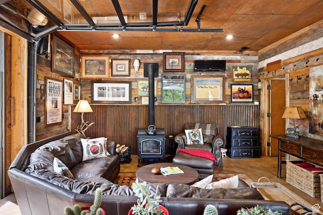 10754 Basin Canyon Rd, Park City, UT 84098 - living area with a wood stove, wooden walls, and concrete flooring