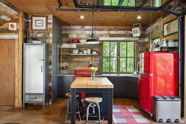 10754 Basin Canyon Rd, Park City, UT 84098 - kitchen with butcher block countertops, freestanding refrigerator, wooden walls, a sink, and finished concrete floors
