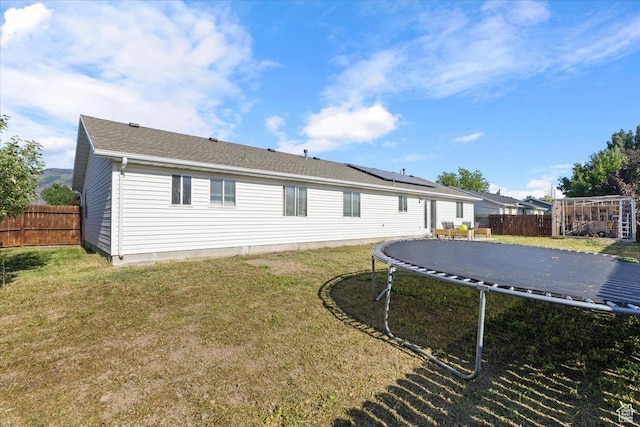 3093 S 1600 W, Nibley, UT 84321 - rear view of property featuring a trampoline