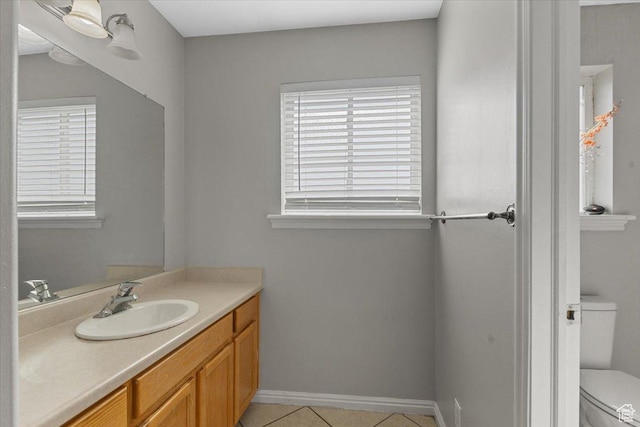 3093 S 1600 W, Nibley, UT 84321 - bathroom featuring toilet, healthy amount of natural light, tile patterned flooring, and vanity