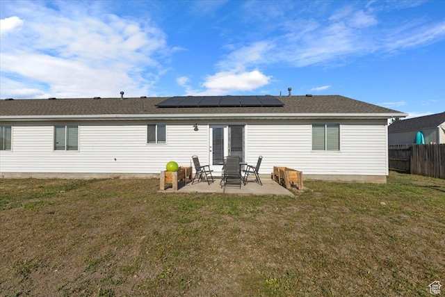 3093 S 1600 W, Nibley, UT 84321 - rear view of house with a patio, roof mounted solar panels, and roof with shingles