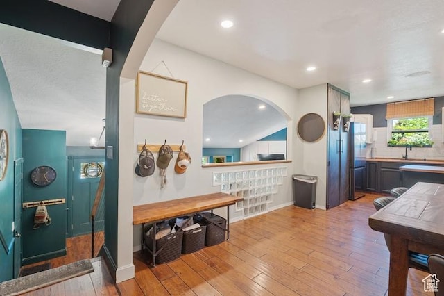 3186 W 5925 S, Roy, UT 84067 - dining room featuring wood-type flooring, baseboards, recessed lighting, and arched walkways