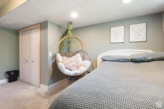 3186 W 5925 S, Roy, UT 84067 - carpeted bedroom with baseboards, a closet, recessed lighting, and a textured ceiling