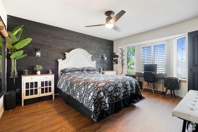 3186 W 5925 S, Roy, UT 84067 - bedroom with an accent wall, an office area, wood finished floors, and a ceiling fan
