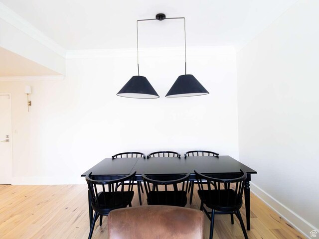 241 N Vine St Unit 1E, Salt Lake City, UT 84103 - dining area with light wood finished floors, ornamental molding, and baseboards