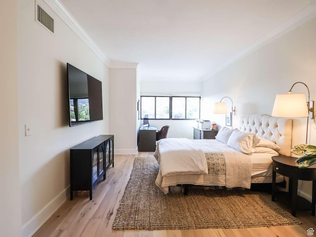 241 N Vine St Unit 1E, Salt Lake City, UT 84103 - bedroom featuring ornamental molding, wood finished floors, and baseboards