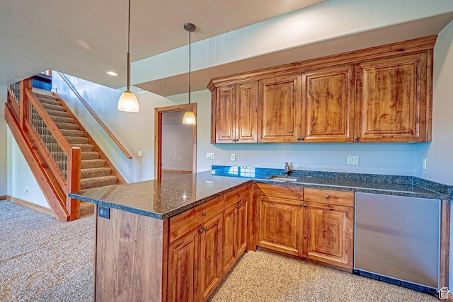 1273 W Lime Canyon Way, Midway, UT 84049 - kitchen with light colored carpet, a sink, brown cabinetry, dark stone counters, and decorative light fixtures