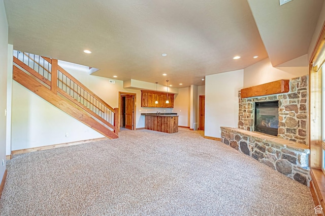 1273 W Lime Canyon Way, Midway, UT 84049 - living area featuring light carpet, recessed lighting, stairway, baseboards, and a fireplace