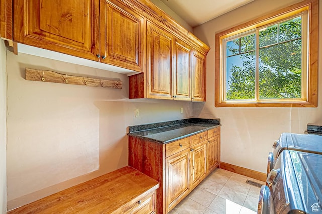 1273 W Lime Canyon Way, Midway, UT 84049 - laundry room featuring cabinet space, washing machine and clothes dryer, baseboards, and light tile patterned floors
