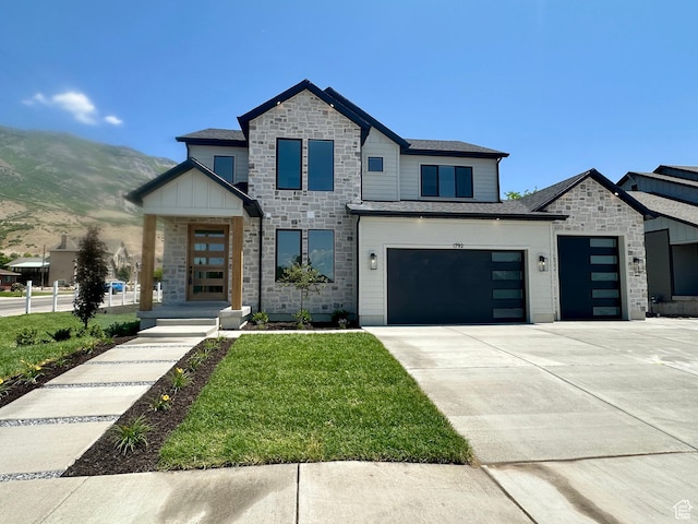 1792 N Siena Cir Unit 13, Pleasant Grove, UT 84062 - contemporary house featuring stone siding, driveway, a mountain view, a front lawn, and an attached garage