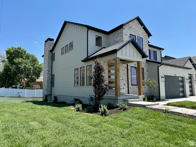1792 N Siena Cir Unit 13, Pleasant Grove, UT 84062 - view of front of home with board and batten siding, an attached garage, driveway, and stone siding