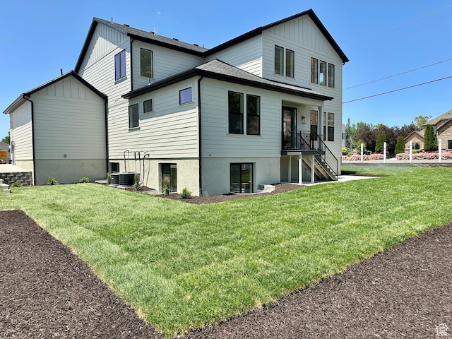 1792 N Siena Cir Unit 13, Pleasant Grove, UT 84062 - rear view of property featuring board and batten siding, a yard, stairway, and central air condition unit