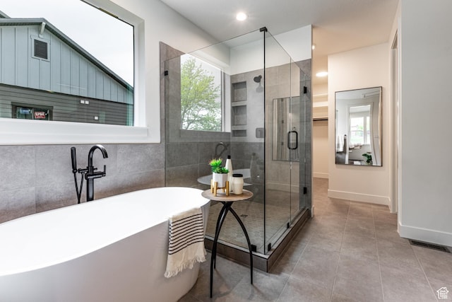 1792 N Siena Cir Unit 13, Pleasant Grove, UT 84062 - bathroom with a freestanding tub, a stall shower, tile patterned flooring, baseboards, and recessed lighting