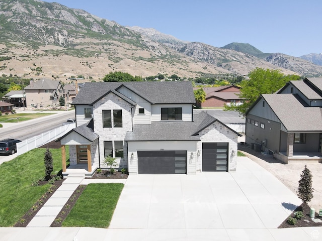 1792 N Siena Cir Unit 13, Pleasant Grove, UT 84062 - contemporary home featuring concrete driveway, a garage, a shingled roof, a residential view, and a mountain view