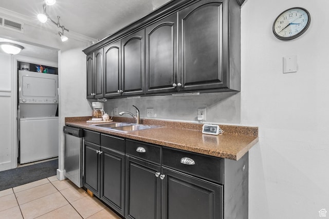 66 W Lester Ave Unit K27, Murray, UT 84107 - kitchen featuring stacked washer / dryer, a sink, stainless steel dishwasher, light tile patterned flooring, and ornamental molding