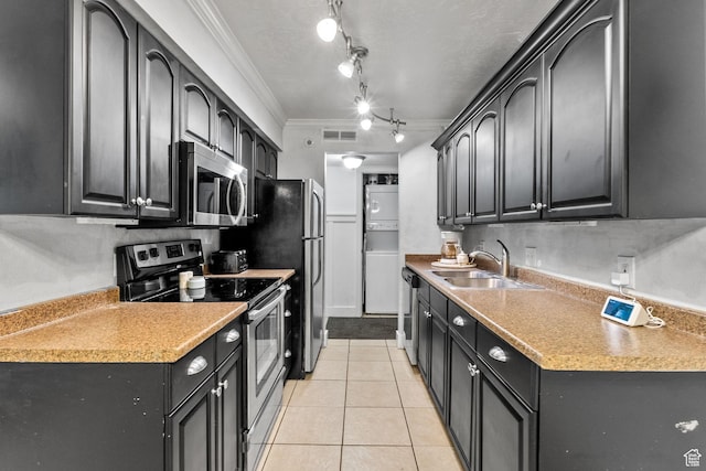 66 W Lester Ave Unit K27, Murray, UT 84107 - kitchen with stainless steel appliances, a sink, light tile patterned floors, ornamental molding, and light countertops