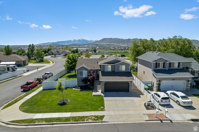 1677 N 2640 W, Lehi, UT 84043 - view of front of home featuring concrete driveway, a garage, a mountain view, a residential view, and roof with shingles