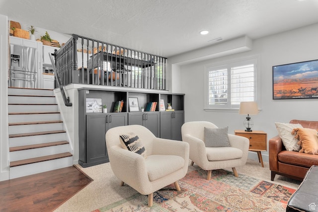 1677 N 2640 W, Lehi, UT 84043 - living room featuring light carpet, stairway, a textured ceiling, and recessed lighting