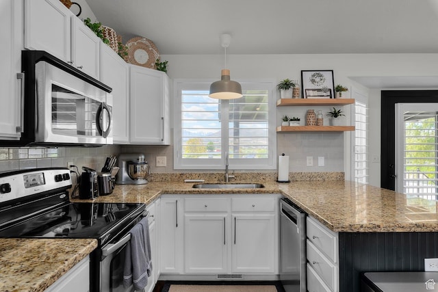 1677 N 2640 W, Lehi, UT 84043 - kitchen featuring stainless steel appliances, a sink, open shelves, white cabinetry, and a peninsula