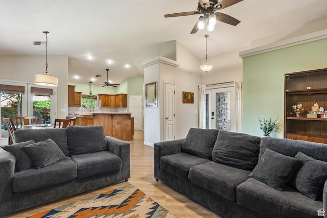 114 E Canterwood Dr, Washington, UT 84780 - living area featuring a ceiling fan, lofted ceiling, and light wood finished floors