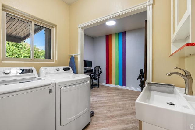 114 E Canterwood Dr, Washington, UT 84780 - washroom featuring light wood finished floors, baseboards, and washing machine and dryer