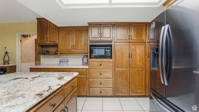 4755 S Banbury, Ogden, UT 84403 - kitchen with stainless steel fridge, black microwave, light tile patterned flooring, and brown cabinetry