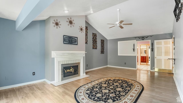 4755 S Banbury, Ogden, UT 84403 - living room featuring a ceiling fan, wood finished floors, a tile fireplace, vaulted ceiling, and baseboards