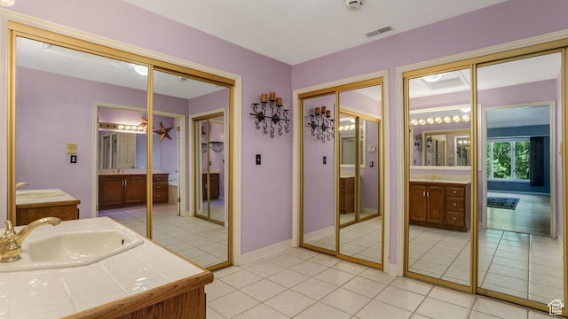 4755 S Banbury, Ogden, UT 84403 - bathroom featuring two vanities and tile patterned flooring