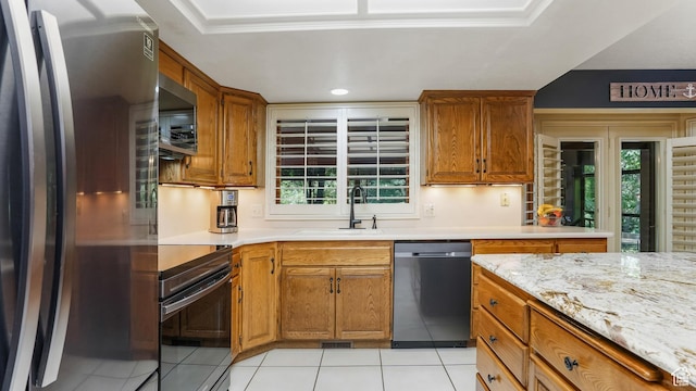 4755 S Banbury, Ogden, UT 84403 - kitchen featuring appliances with stainless steel finishes, a sink, light tile patterned floors, healthy amount of natural light, and recessed lighting