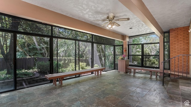 4755 S Banbury, Ogden, UT 84403 - unfurnished sunroom with stone tile floors, ceiling fan, and a textured ceiling