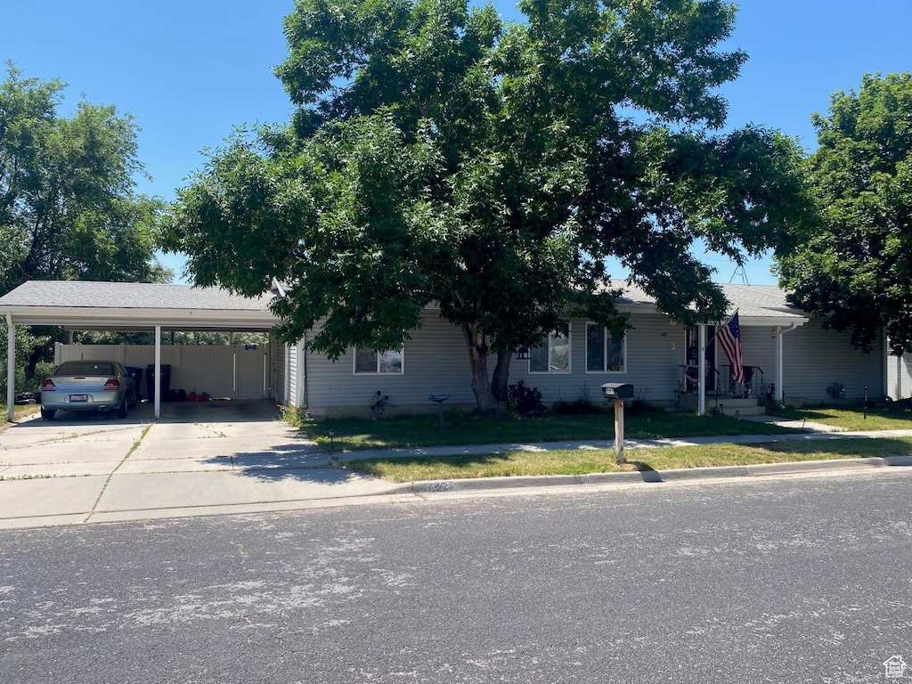 1067 W 700 S, Brigham City, UT 84302 - view of front of home with driveway and a front yard