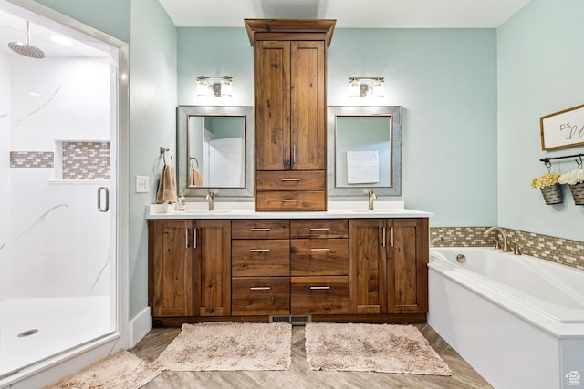580 N Cherry Ridge Ln, Richmond, UT 84333 - bathroom featuring a shower stall, double vanity, a bath, and wood finished floors