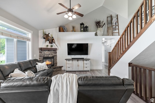580 N Cherry Ridge Ln, Richmond, UT 84333 - living area featuring lofted ceiling, wood finished floors, ceiling fan, a fireplace, and stairway