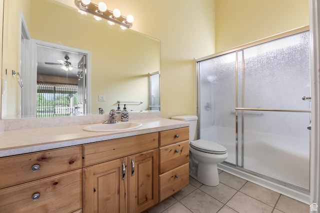 18 Clubhouse Dr, Stansbury Park, UT 84074 - bathroom featuring tile patterned floors, vanity, toilet, and a shower stall