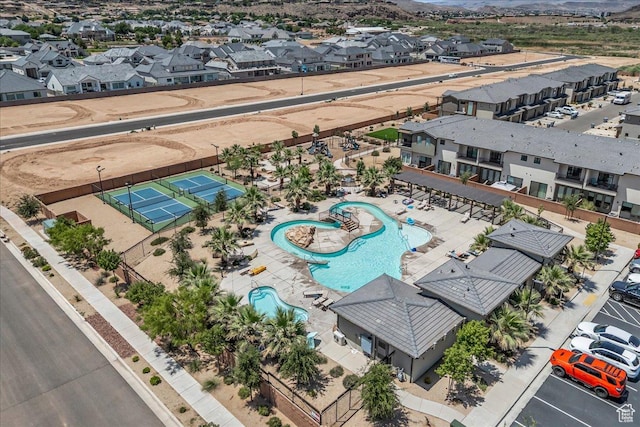 2667 E Wake Ln, St George, UT 84790 - aerial view of residential area with a pool and a mountainous background