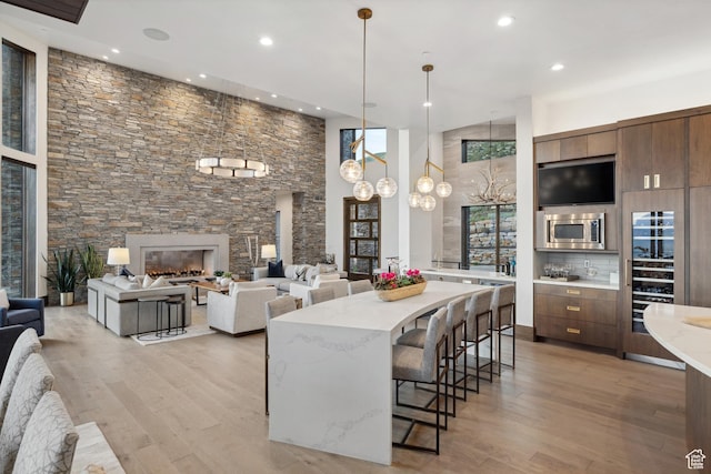 1703 N Chimney Rock Rd Unit 532, Heber City, UT 84032 - kitchen with stainless steel microwave, recessed lighting, a breakfast bar area, light wood-type flooring, and modern cabinets