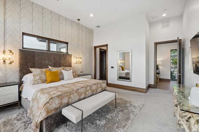 1703 N Chimney Rock Rd Unit 532, Heber City, UT 84032 - carpeted bedroom featuring baseboards, recessed lighting, an accent wall, and a towering ceiling